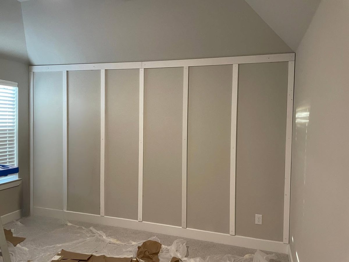 Before: white board and batten trim on a gray wall