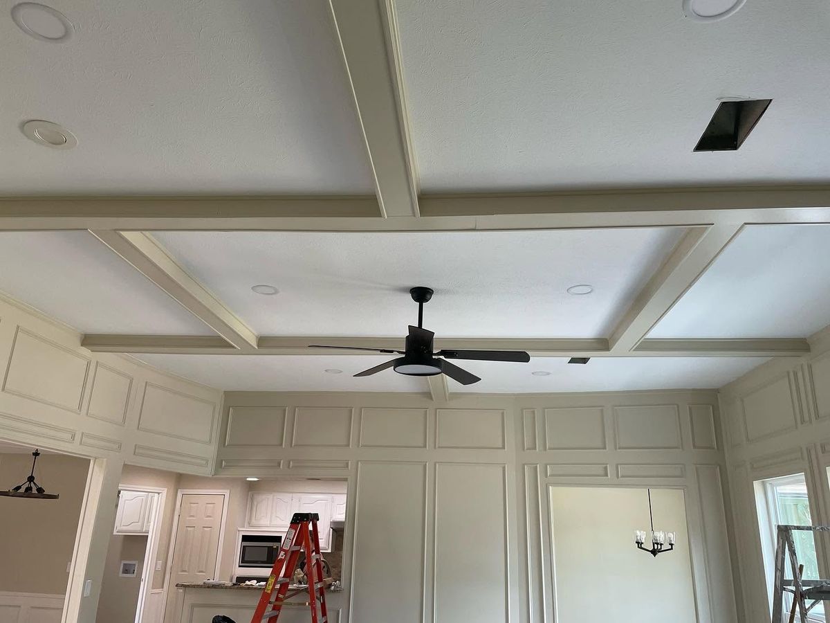 Coffered ceiling and paneled walls painted in a soft neutral