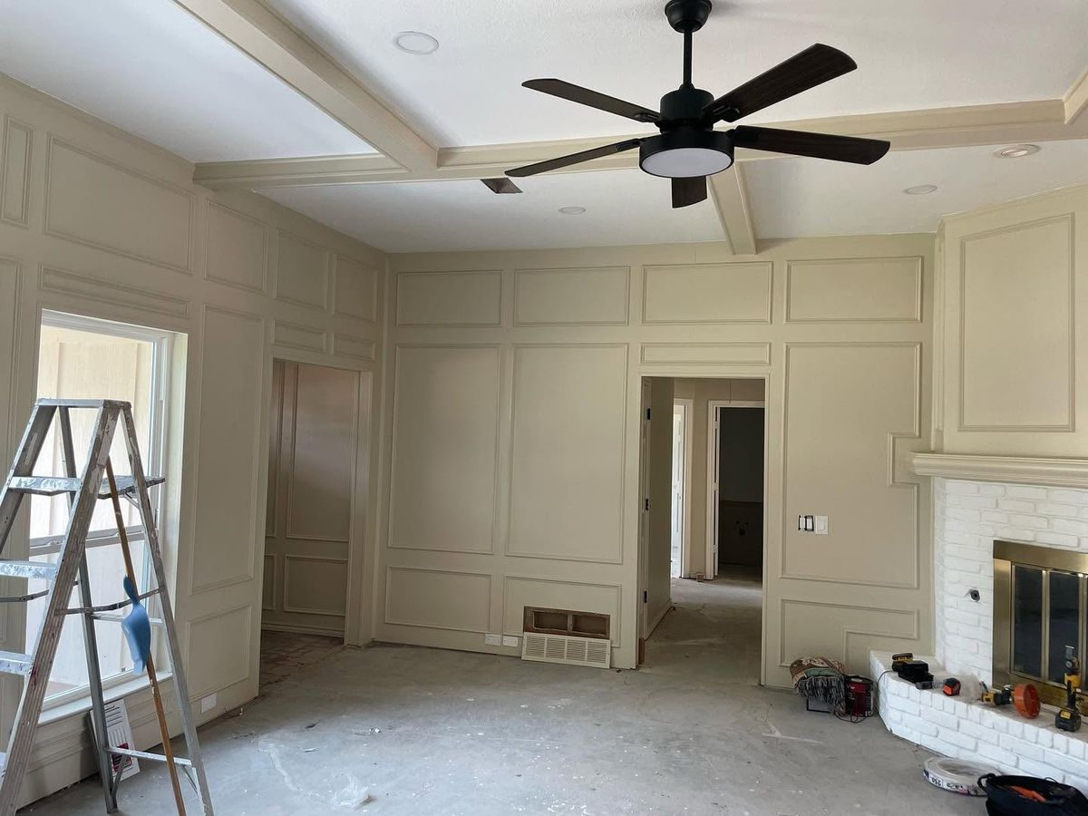Paneled living room walls and trim freshly painted